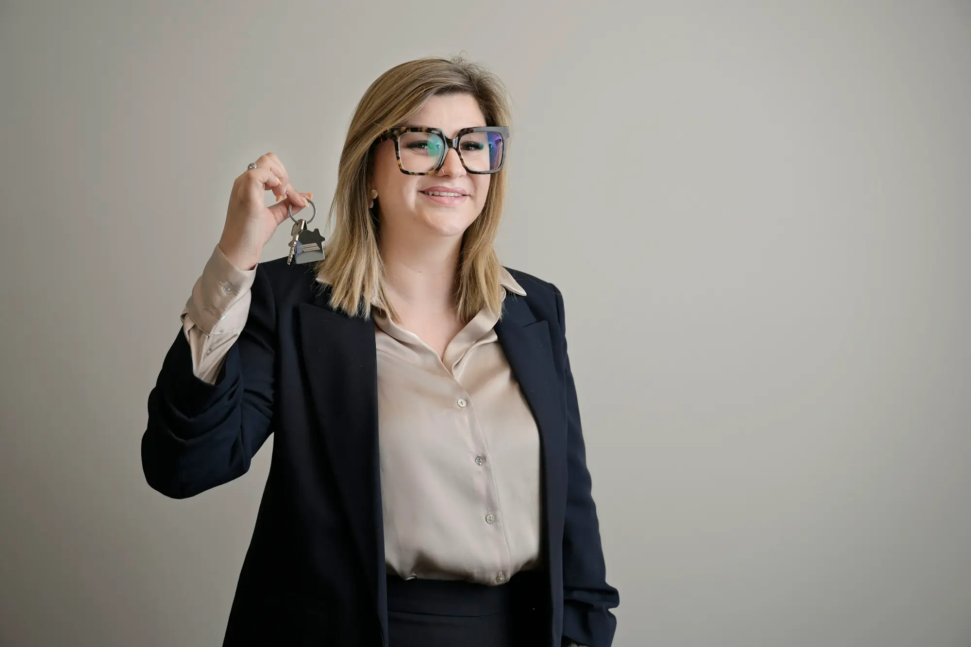 Professional woman holding up a set of keys