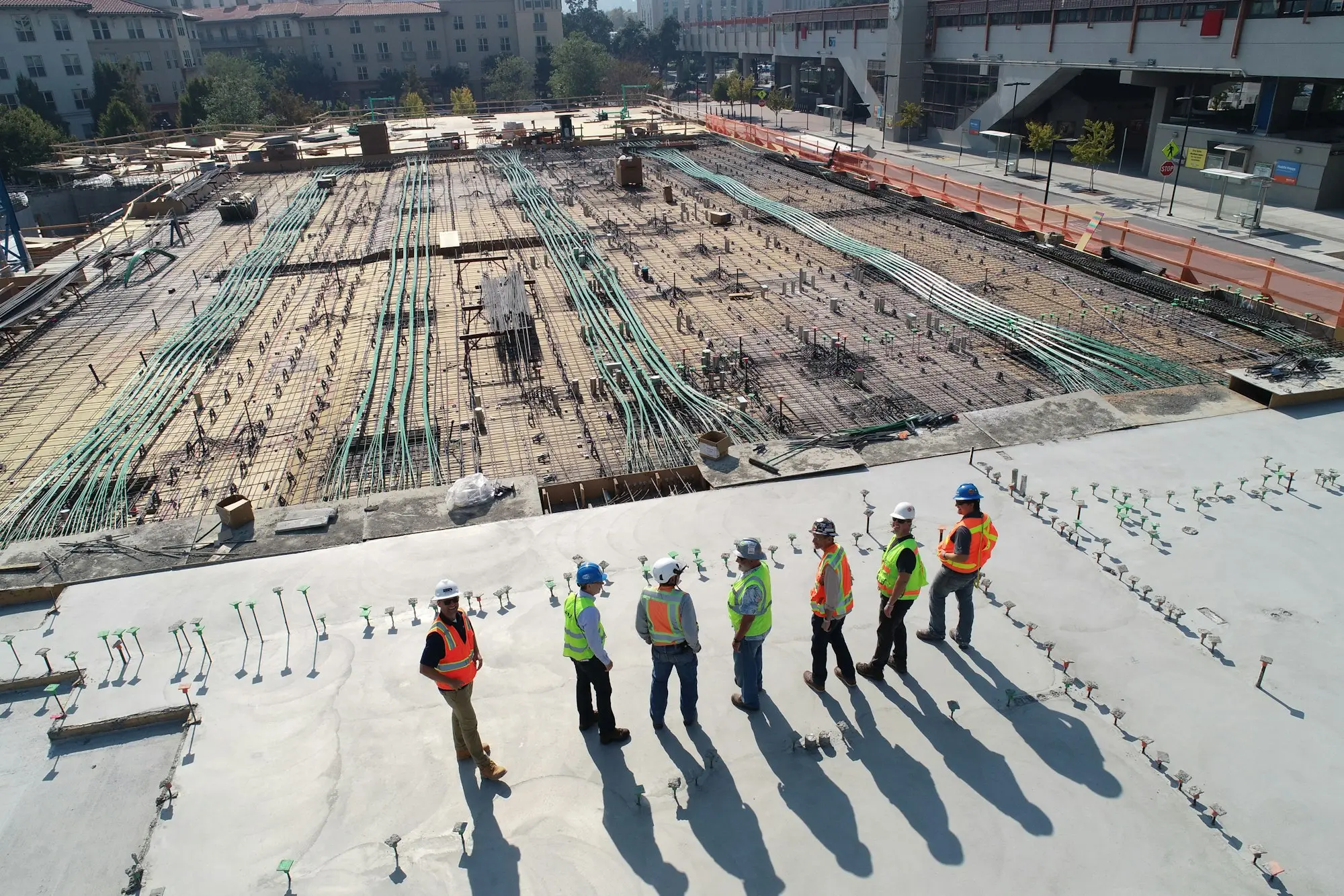 Construction crew walking across a building site