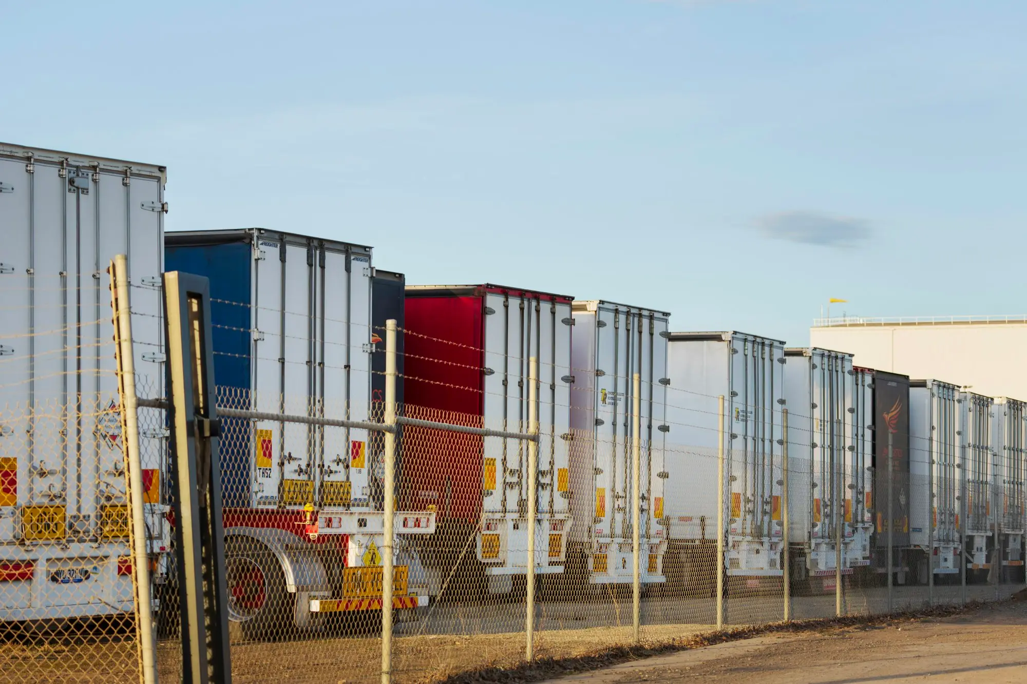 Row of parked trailers at a depot