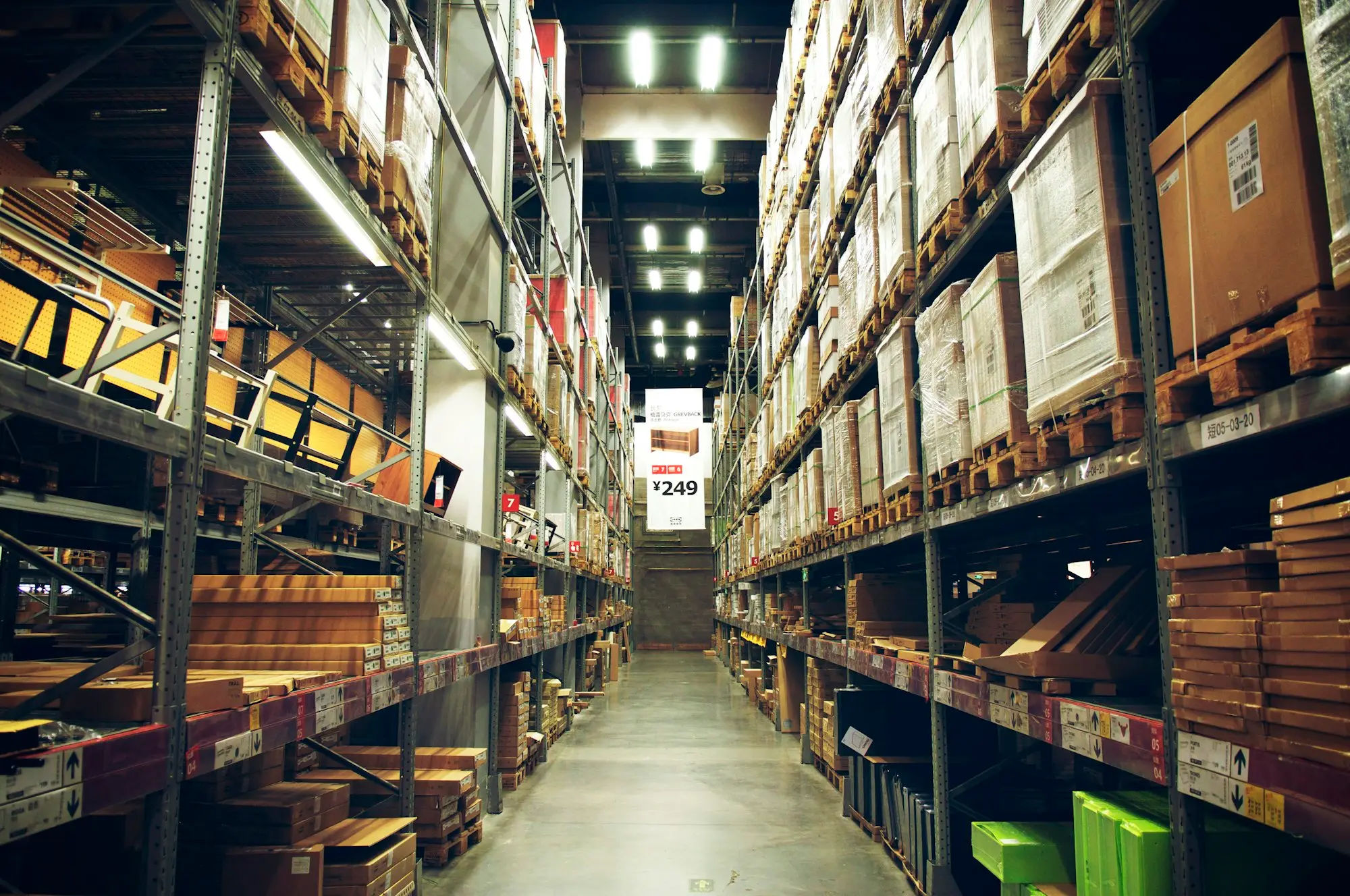 Warehouse aisle with stocked racking
